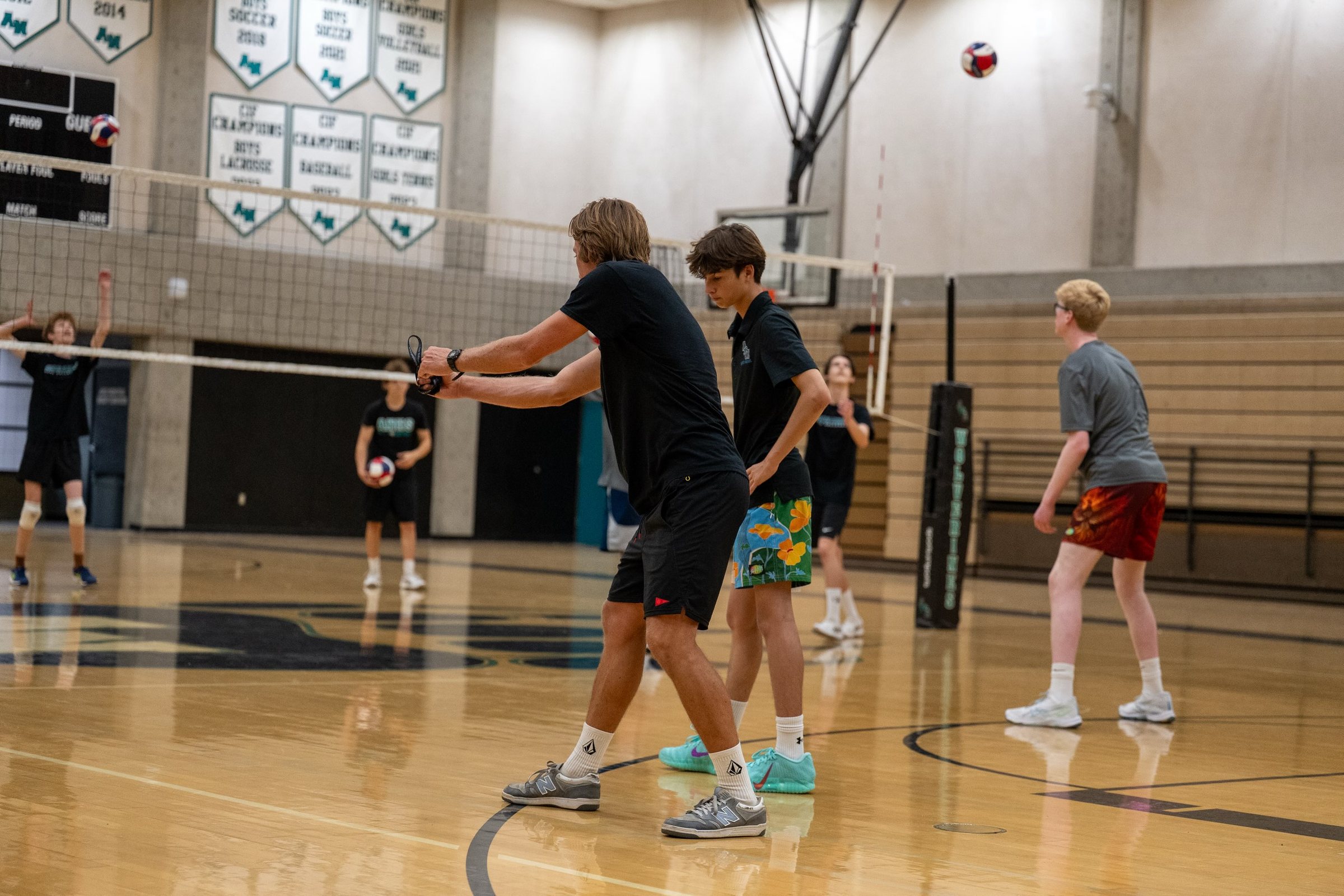 A coach demonstrates a passing platform to campers