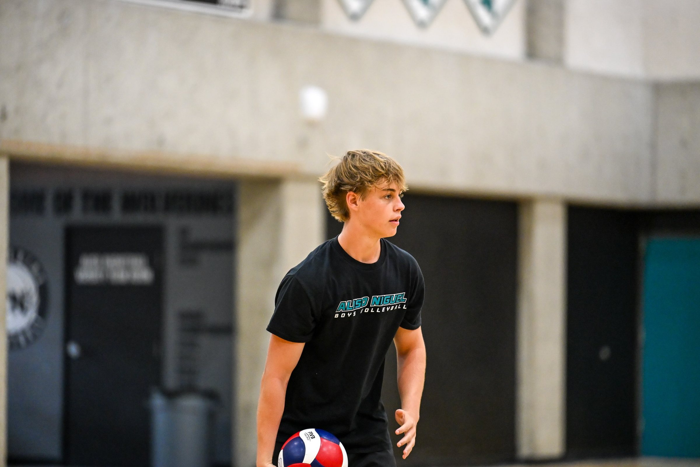 A player holds a ball between drills